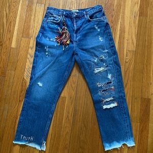 AGOLDE Hand embroidery detail. “AWAKE” “CHILL” “TRUTH” “FREE” “SELF” 11:11